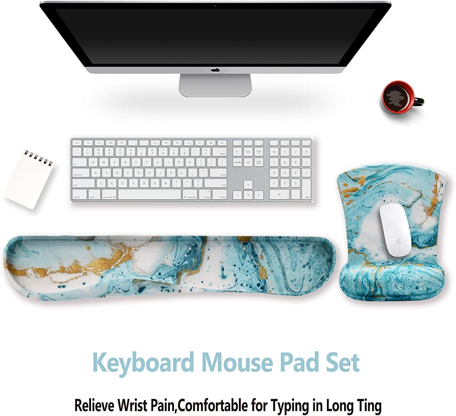 Marble-patterned keyboard, mouse pad, and wrist rest set on a desk with a computer monitor.
