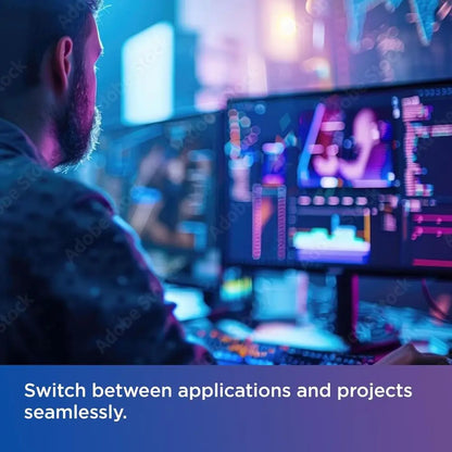 Person working at a computer with multiple screens in a blurred cityscape background