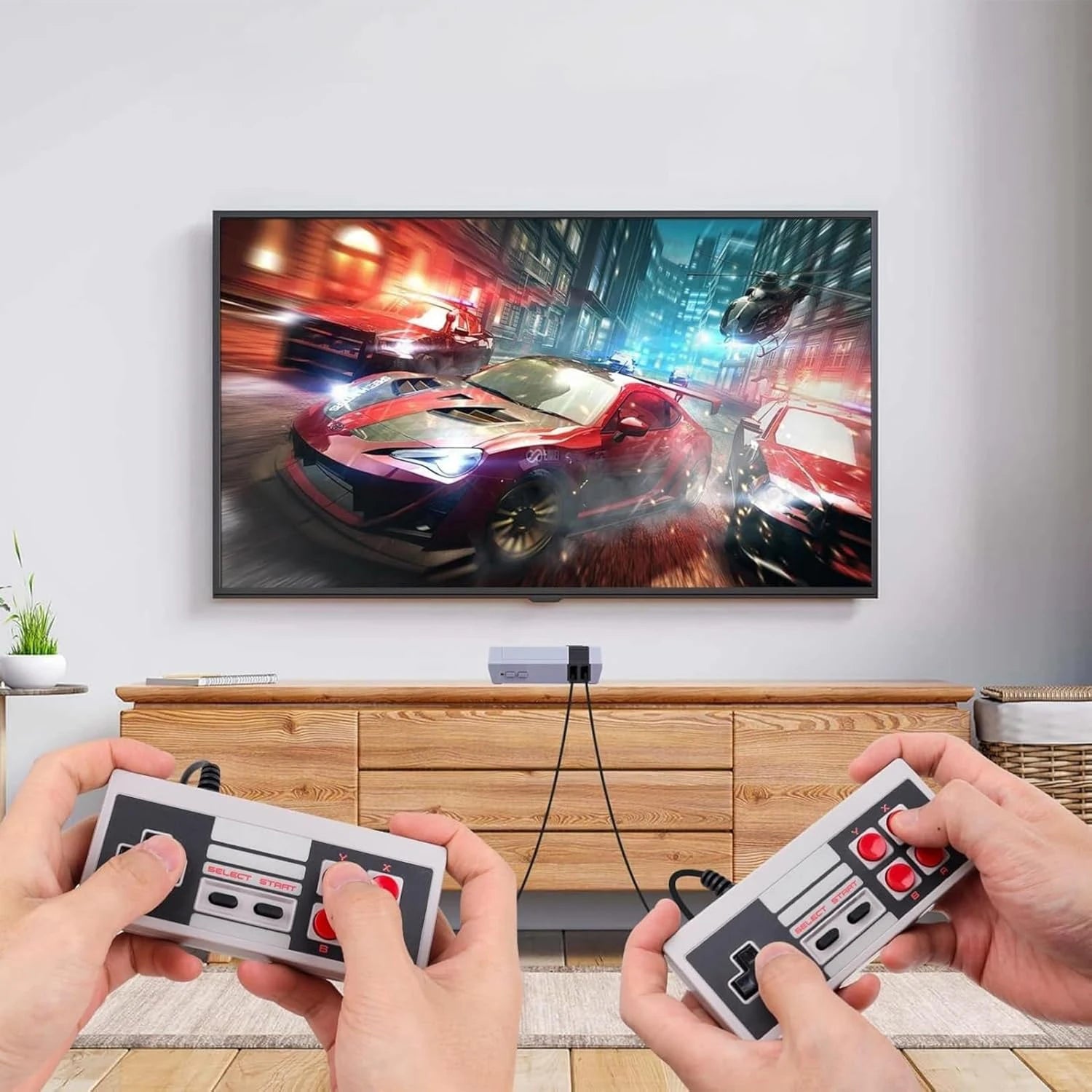 Two people playing a racing game on a TV with classic gaming controllers.